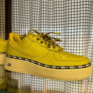 Yellow and black Nike Air Force Ones